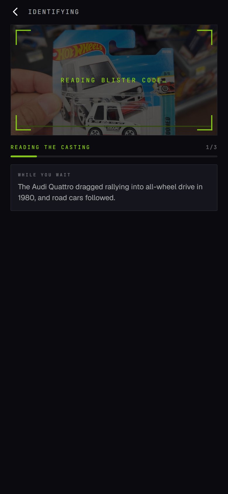 A carded Hot Wheels car being identified